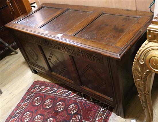 A 17th century oak coffer W.129cm